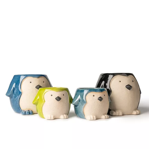 Castiçais de cerâmica em formato de pinguim Castiçais de cerâmica em formato de pinguim